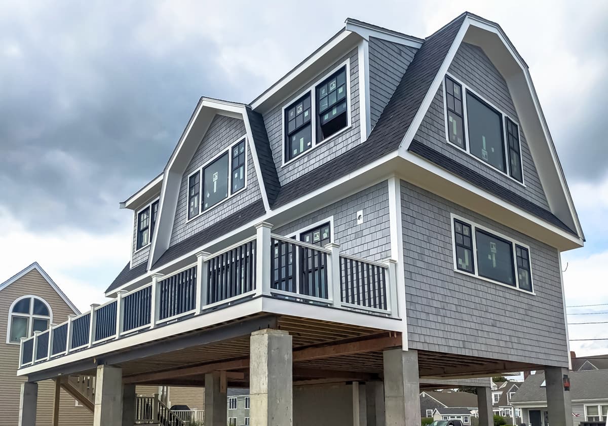 Flood-zone coastal home on concrete piers — Longfellow Design Build
